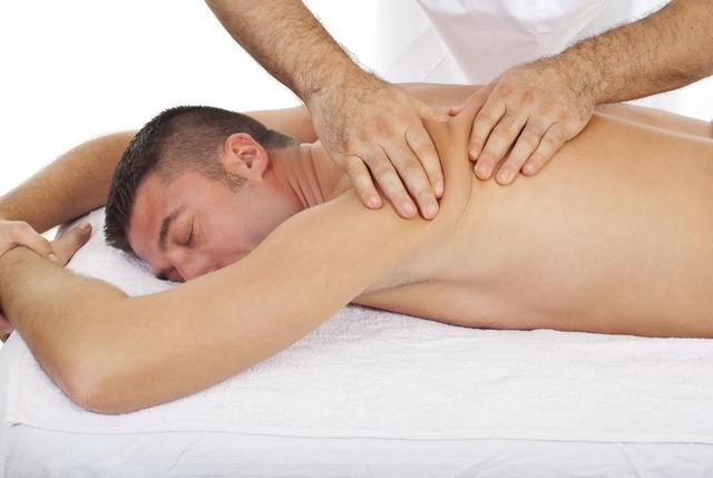 Young man receiving massage therapy